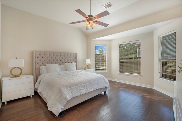 bedroom featuring ceiling fan, dark wood-type flooring, and vaulted ceiling