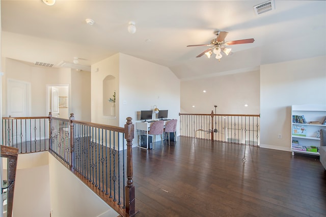 interior space featuring dark hardwood / wood-style flooring and lofted ceiling