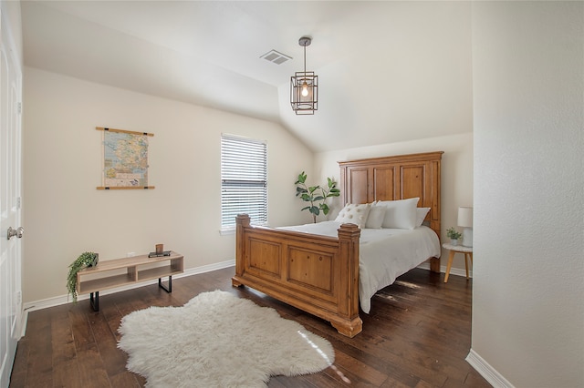 bedroom featuring dark hardwood / wood-style floors and vaulted ceiling