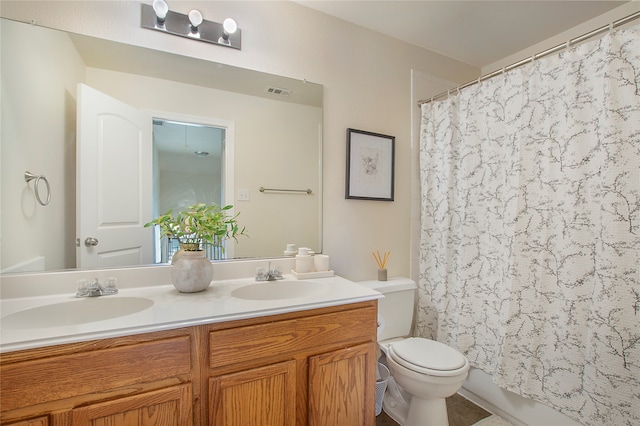 full bathroom with shower / bathtub combination with curtain, vanity, and toilet