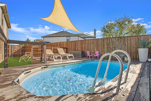 view of pool with a wooden deck