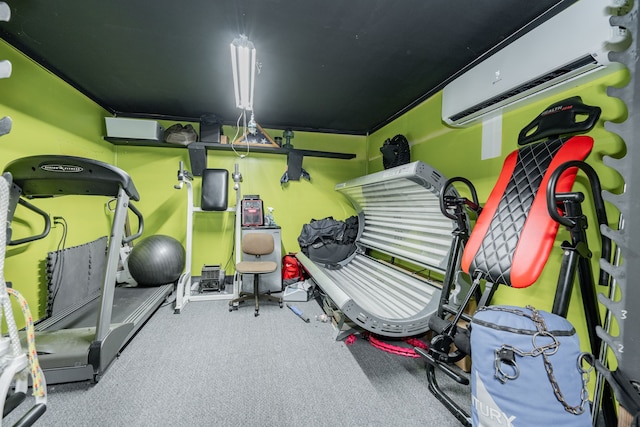 workout room with an AC wall unit and carpet floors