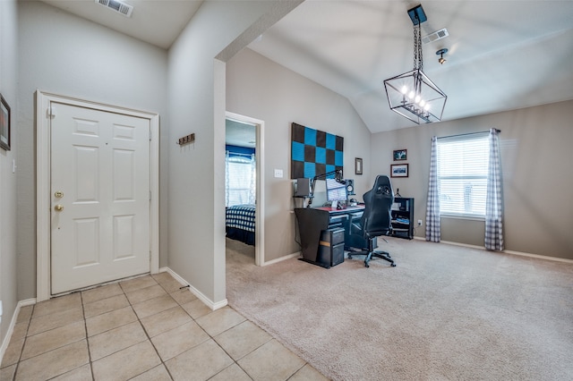 carpeted office space featuring an inviting chandelier and vaulted ceiling