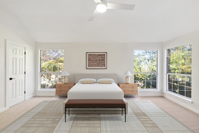 bedroom with light colored carpet and ceiling fan