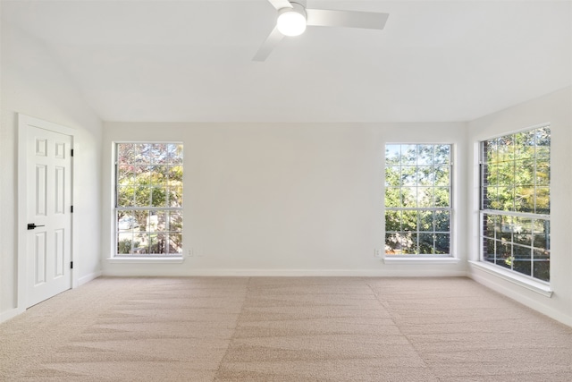 unfurnished room featuring light colored carpet and ceiling fan