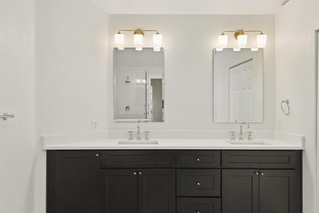 bathroom with vanity and a shower