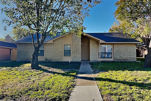 ranch-style house with a front yard