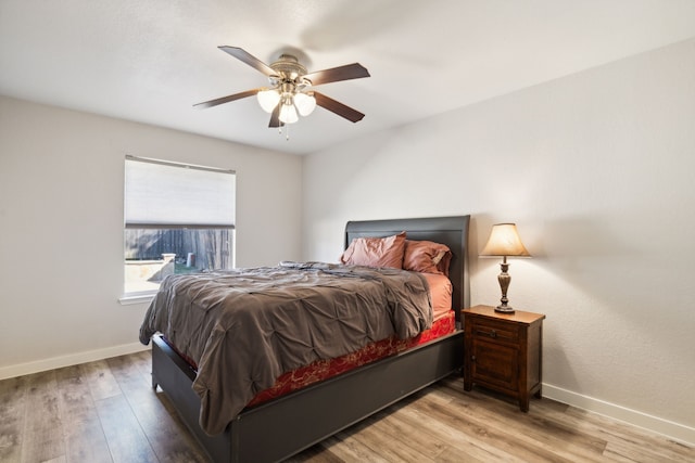 bedroom featuring light hardwood / wood-style floors and ceiling fan