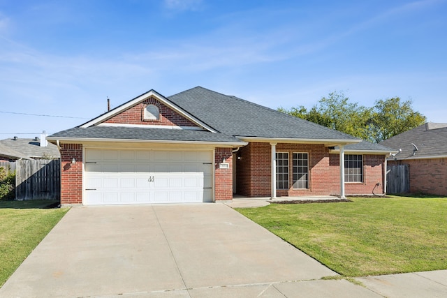 single story home featuring a front lawn and a garage