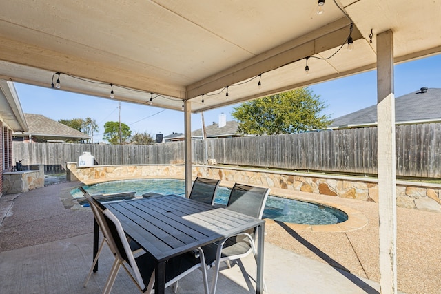 view of patio / terrace with a fenced in pool