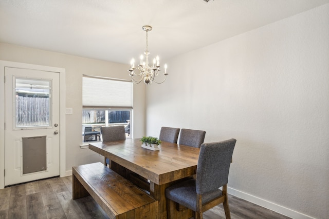 dining area featuring a chandelier and dark hardwood / wood-style floors