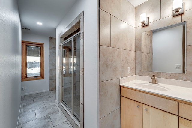 bathroom with vanity and walk in shower