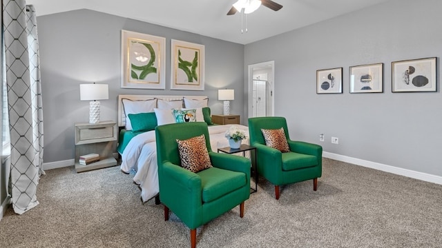 bedroom with carpet flooring, ceiling fan, ensuite bathroom, and vaulted ceiling