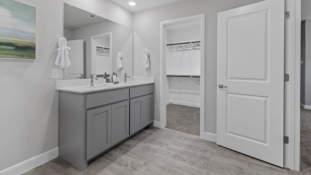 bathroom featuring vanity and hardwood / wood-style flooring