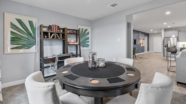 dining room with light hardwood / wood-style flooring