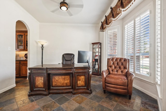 office featuring ornamental molding, ceiling fan, and a healthy amount of sunlight