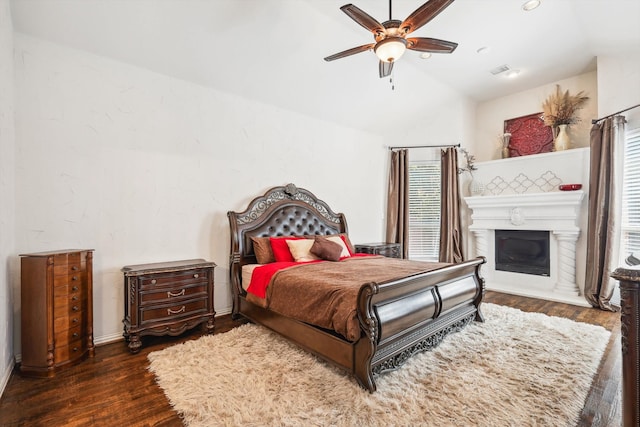 bedroom featuring vaulted ceiling, ceiling fan, and dark wood-type flooring