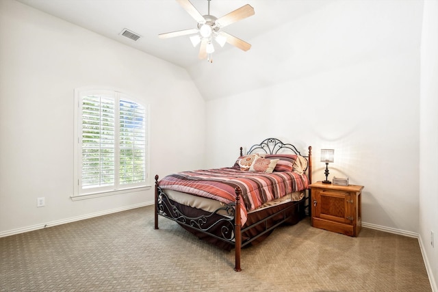 bedroom featuring ceiling fan, carpet floors, and vaulted ceiling