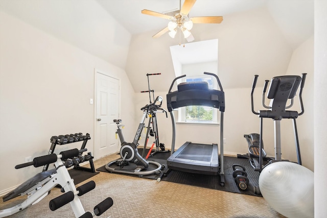 workout area with ceiling fan, carpet floors, and vaulted ceiling