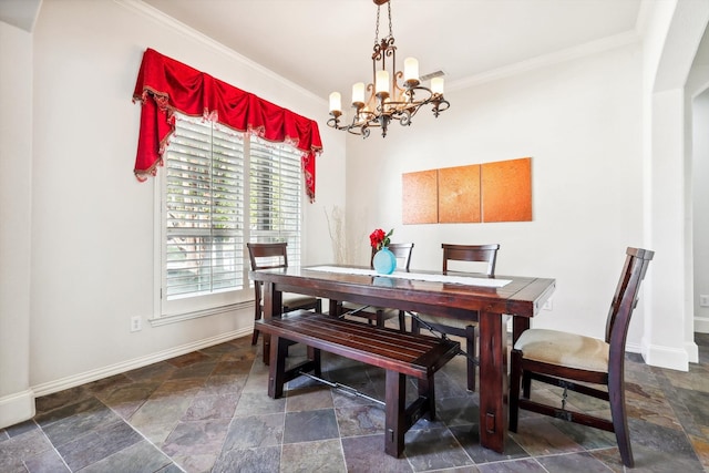 dining room featuring an inviting chandelier and ornamental molding