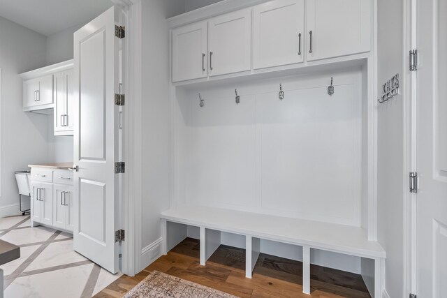 mudroom with light hardwood / wood-style floors