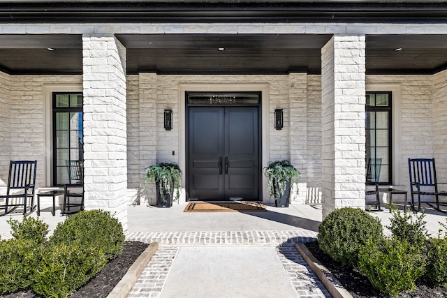 doorway to property featuring a porch