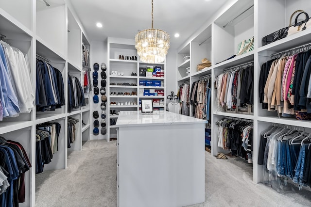 walk in closet featuring light carpet and a notable chandelier