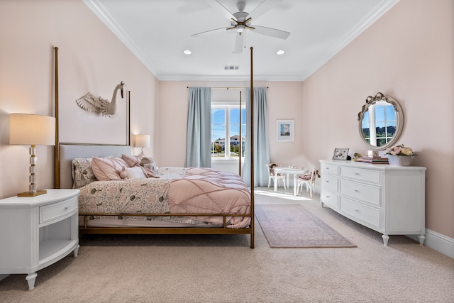 carpeted bedroom featuring ceiling fan and ornamental molding