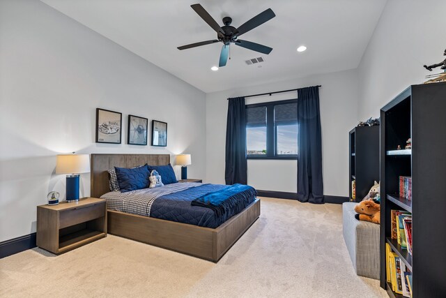 bedroom featuring ceiling fan and light colored carpet