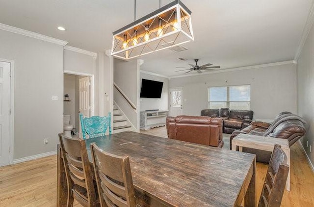 dining space featuring ceiling fan, ornamental molding, and light hardwood / wood-style floors