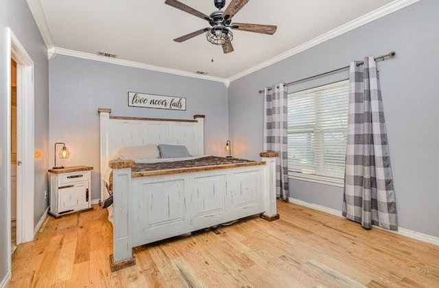 bedroom featuring ornamental molding, ceiling fan, and light wood-type flooring