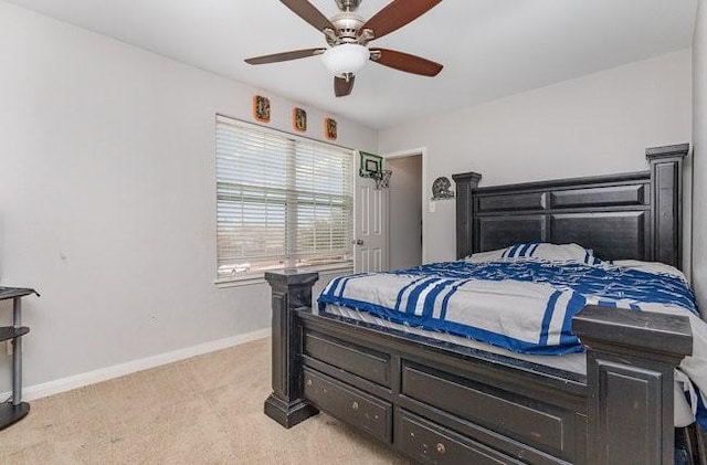 bedroom featuring light carpet and ceiling fan