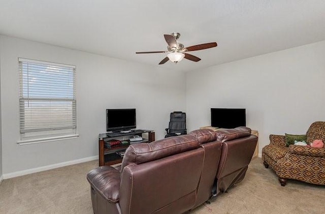 living room featuring light carpet and ceiling fan