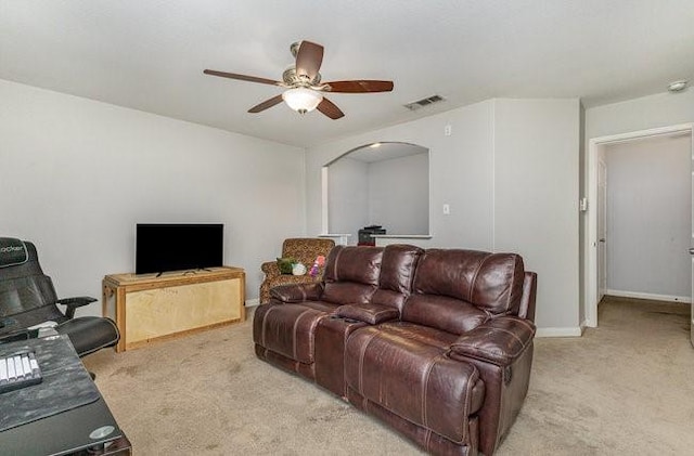 living room featuring ceiling fan and light colored carpet