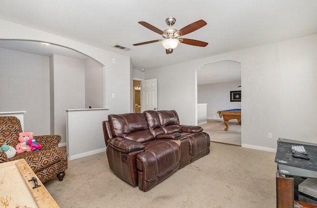 living room featuring pool table, light colored carpet, and ceiling fan