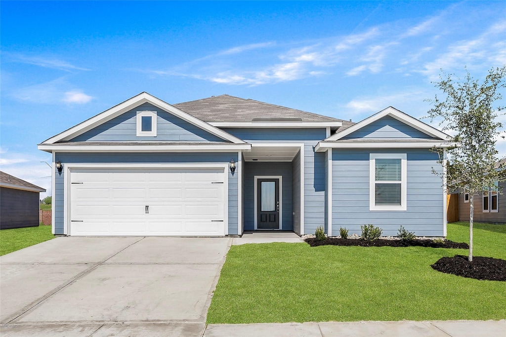 single story home featuring a front lawn and a garage