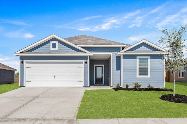 single story home featuring a front lawn and a garage