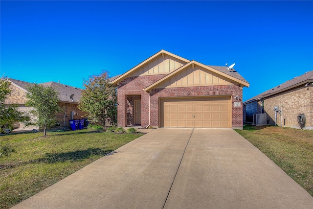 view of front of home with a front lawn, a garage, and central AC unit