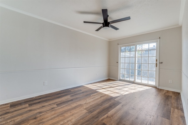 empty room with ceiling fan, wood-type flooring, a textured ceiling, and ornamental molding