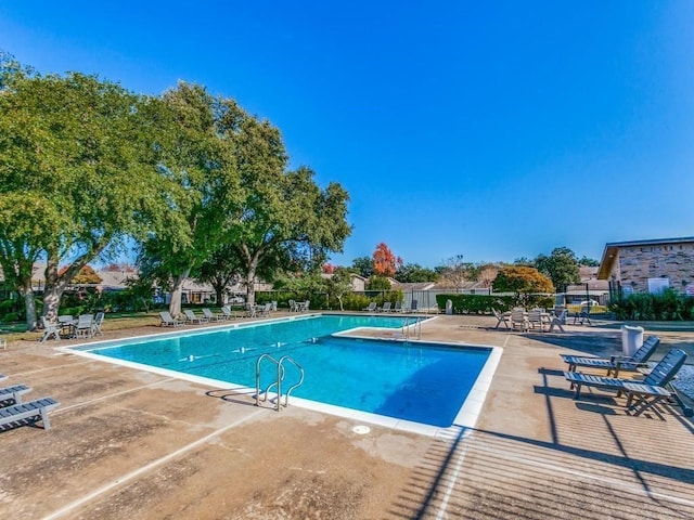 view of swimming pool with a patio area