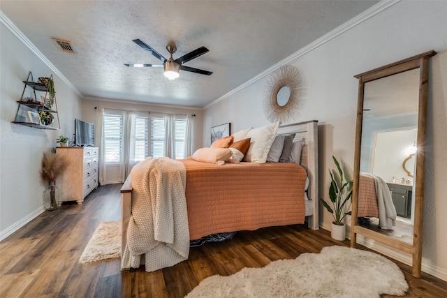 bedroom featuring a textured ceiling, dark hardwood / wood-style flooring, ceiling fan, and ornamental molding