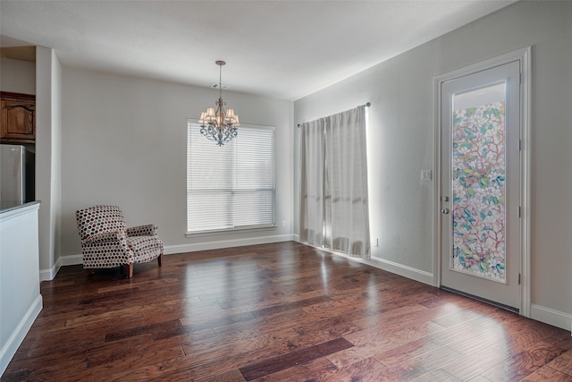 interior space with a chandelier and dark wood-type flooring