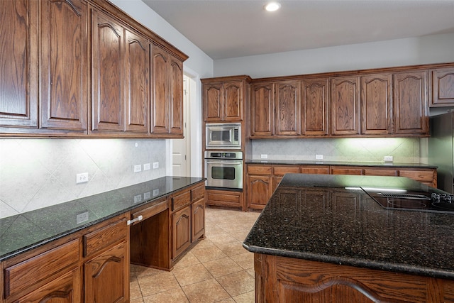 4844 Exposition Way, Fort Worth, TX 76244 - kitchen with stainless steel appliances, dark stone countertops, backsplash, light tile patterned floors, and recessed lighting
