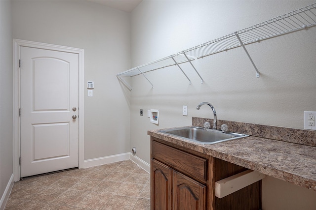 laundry area featuring electric dryer hookup, hookup for a washing machine, and sink