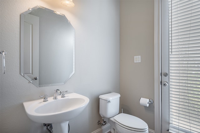 bathroom featuring sink and toilet