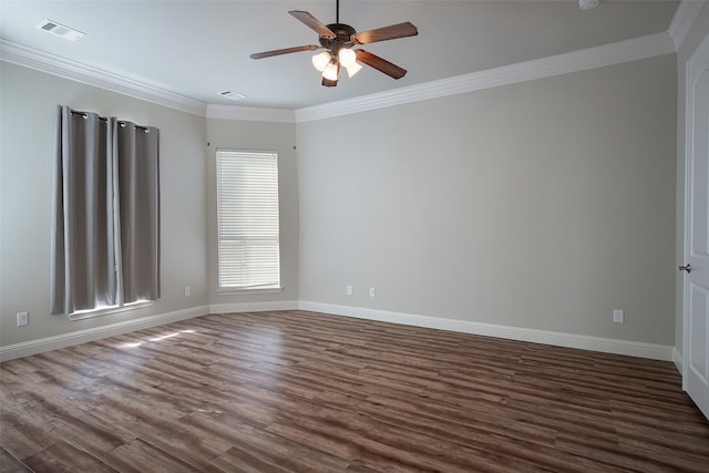 empty room with dark hardwood / wood-style flooring, ceiling fan, and ornamental molding