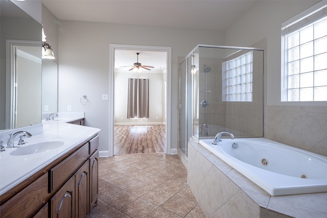 bathroom with tile patterned floors, ceiling fan, vanity, and shower with separate bathtub