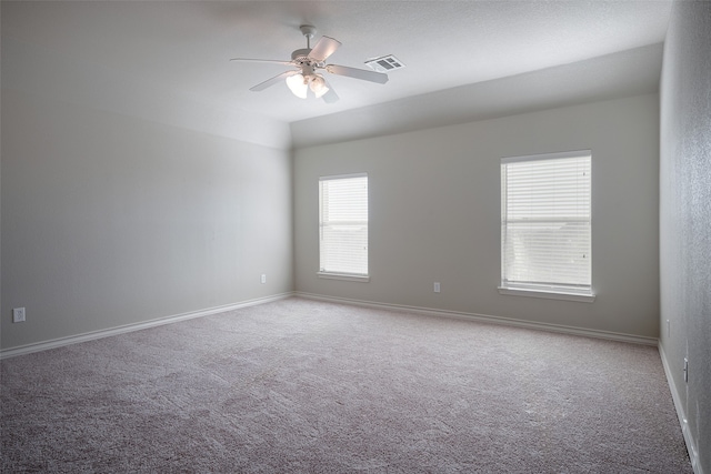 empty room with carpet flooring and ceiling fan