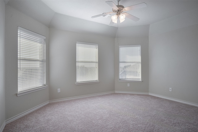 unfurnished room featuring carpet, ceiling fan, and lofted ceiling