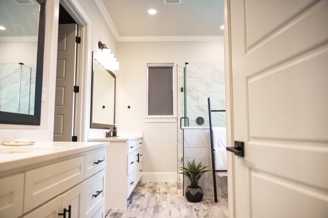 bathroom with wood-type flooring, an enclosed shower, vanity, and crown molding